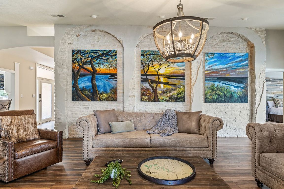 925 Challenger Lakeway, TX 78734 - Photo 5 of 40 a living room with furniture a potted plant and a large window