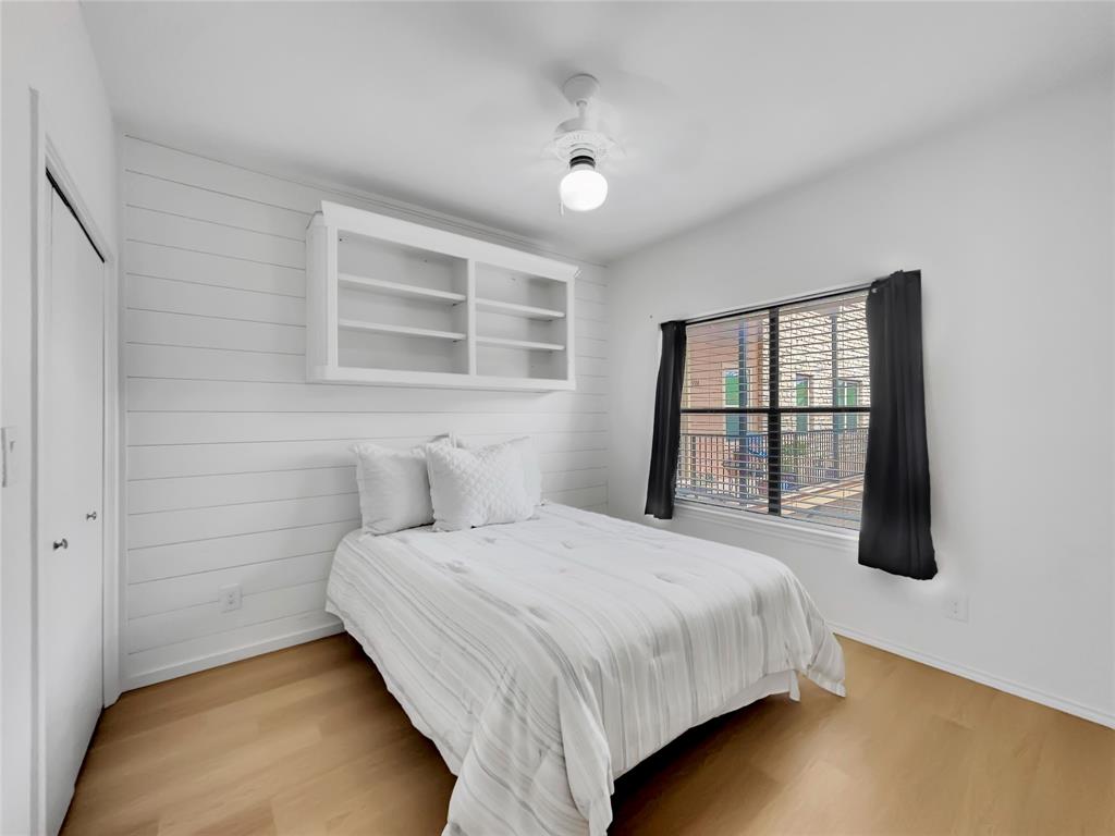 401 East Pearl Street, Unit 2307 Granbury, TX 76048 - Photo 13 of 21 a bedroom with a bed and a window