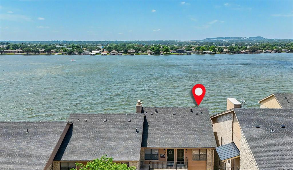 401 East Pearl Street, Unit 2307 Granbury, TX 76048 - Photo 15 of 21 an aerial view of a house with a lake view