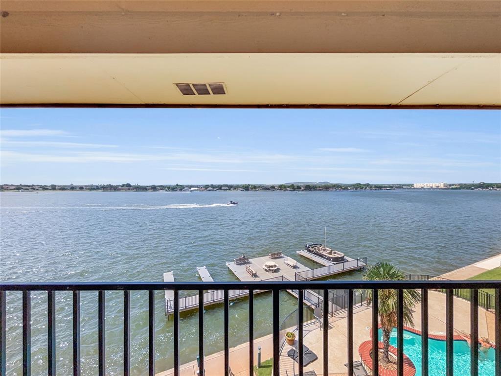 401 East Pearl Street, Unit 2307 Granbury, TX 76048 - Photo 17 of 21 a balcony with an outdoor space
