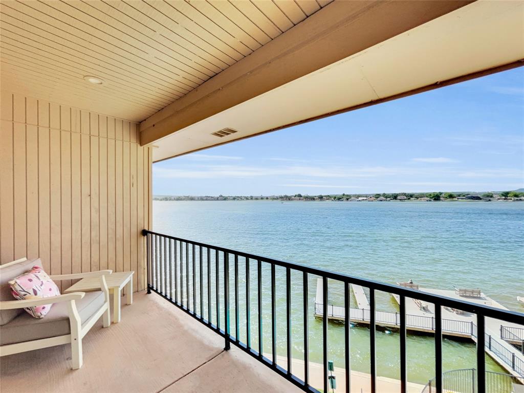 401 East Pearl Street, Unit 2307 Granbury, TX 76048 - Photo 19 of 21 a balcony with hardwood