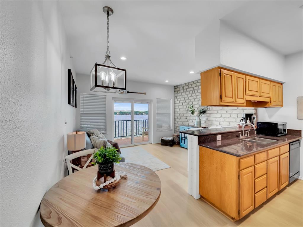 401 East Pearl Street, Unit 2307 Granbury, TX 76048 - Photo 20 of 21 a kitchen with sink refrigerator and microwave
