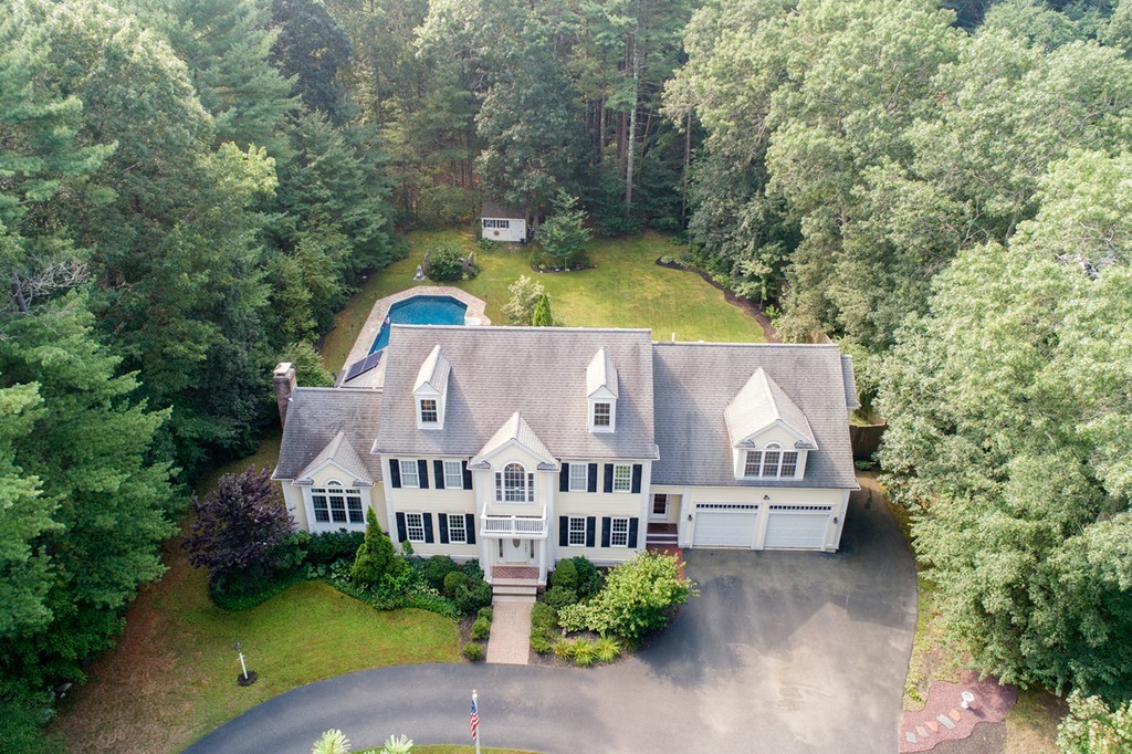 301 Union Street Hanover, MA 02339 - Photo 1 of 30 an aerial view of a house with swimming pool and garden