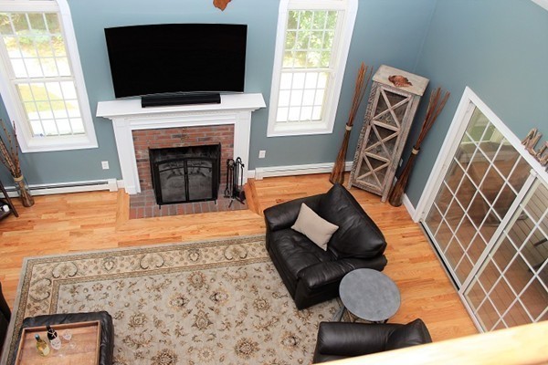 301 Union Street Hanover, MA 02339 - Photo 14 of 30 a living room with furniture and a flat screen tv