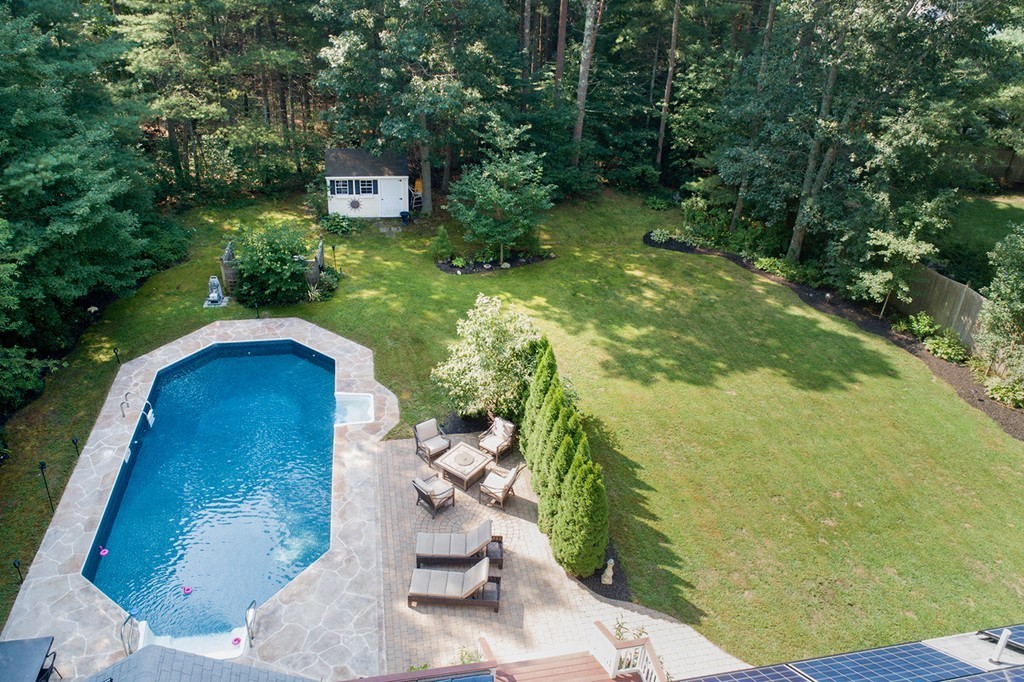 301 Union Street Hanover, MA 02339 - Photo 28 of 30 a backyard of a house with a yard and outdoor seating