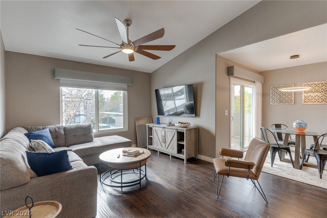 7255 West Sunset Road, Unit 2155 Las Vegas, NV 89113 - Photo 8 of 21 Living area with lofted ceiling, dark wood-type flooring, and ceiling fan
