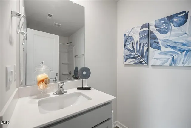 a bathroom with a tub a sink and a shower