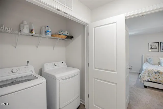 a living room with furniture and a painting