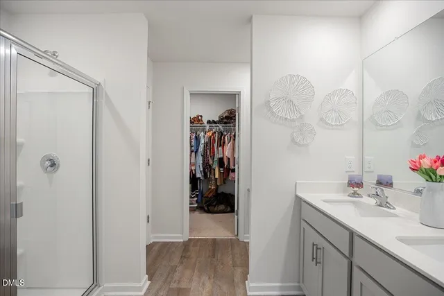 a bathroom with a sink vanity and a mirror