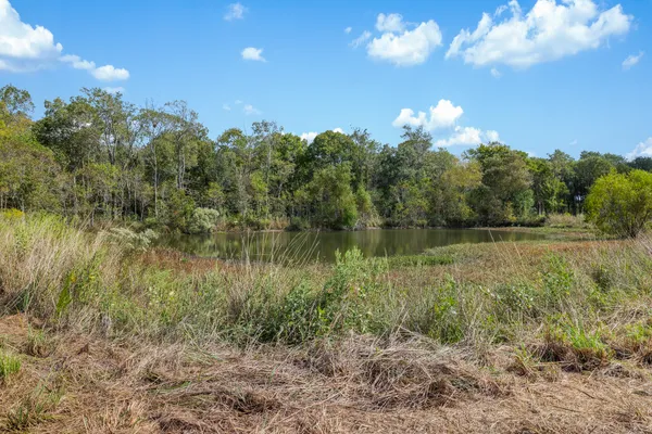 a view of a lake with a yard