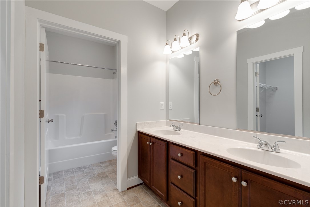 17715 Tyler Station Road Beaverdam, VA 23015 - Photo 11 of 18 a spacious bathroom with a double vanity sink mirror and shower
