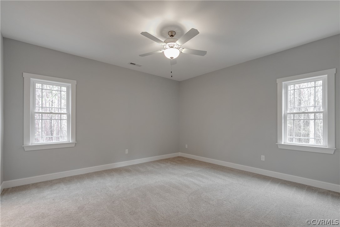 17715 Tyler Station Road Beaverdam, VA 23015 - Photo 14 of 18 an empty room with window and ceiling fan
