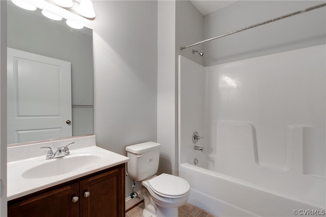 17715 Tyler Station Road Beaverdam, VA 23015 - Photo 16 of 18 a bathroom with a sink a toilet and shower