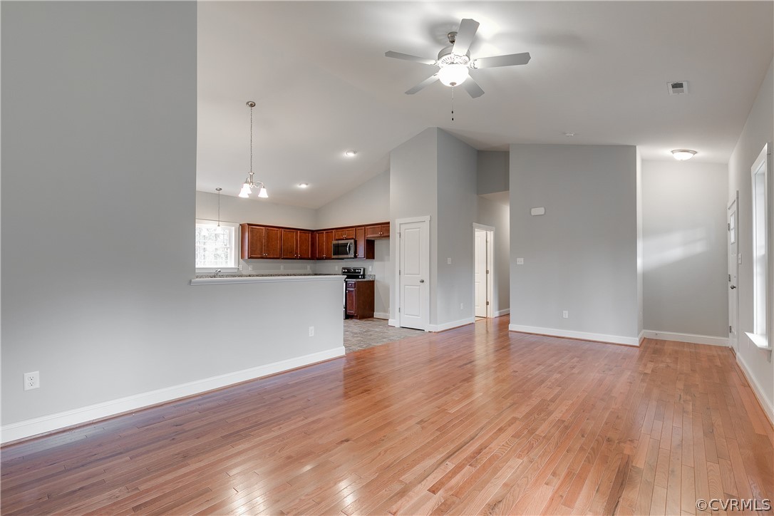 17715 Tyler Station Road Beaverdam, VA 23015 - Photo 3 of 18 a view of a big room with wooden floor and a kitchen