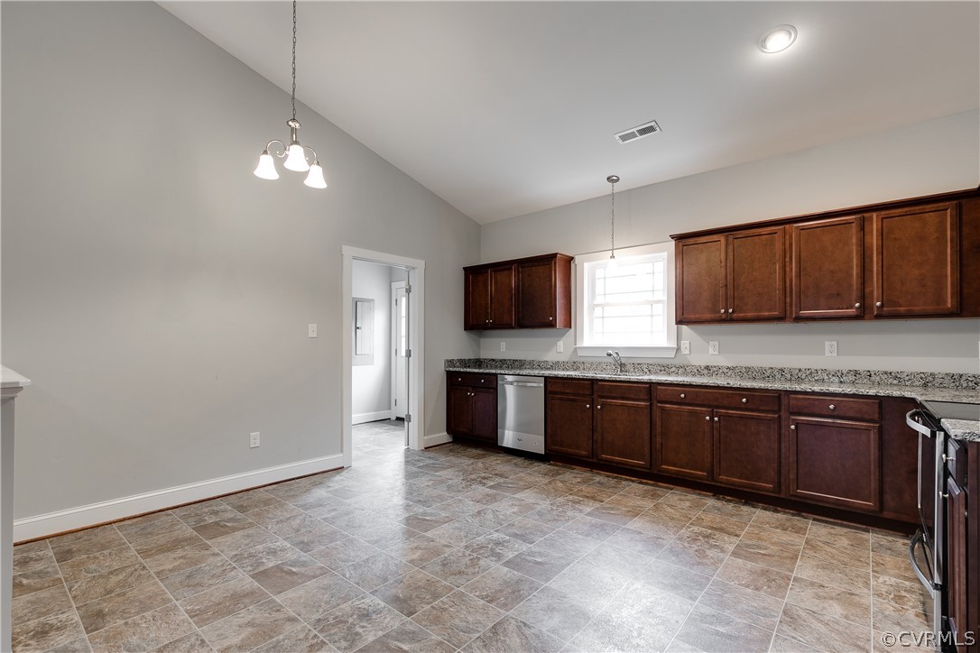 17715 Tyler Station Road Beaverdam, VA 23015 - Photo 5 of 18 a large kitchen with granite countertop a sink and a stove top oven