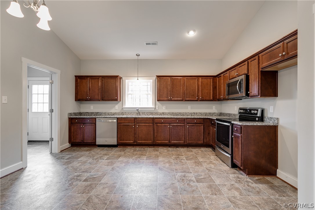 17715 Tyler Station Road Beaverdam, VA 23015 - Photo 6 of 18 a kitchen with stainless steel appliances wooden cabinets a stove top oven a sink and dishwasher
