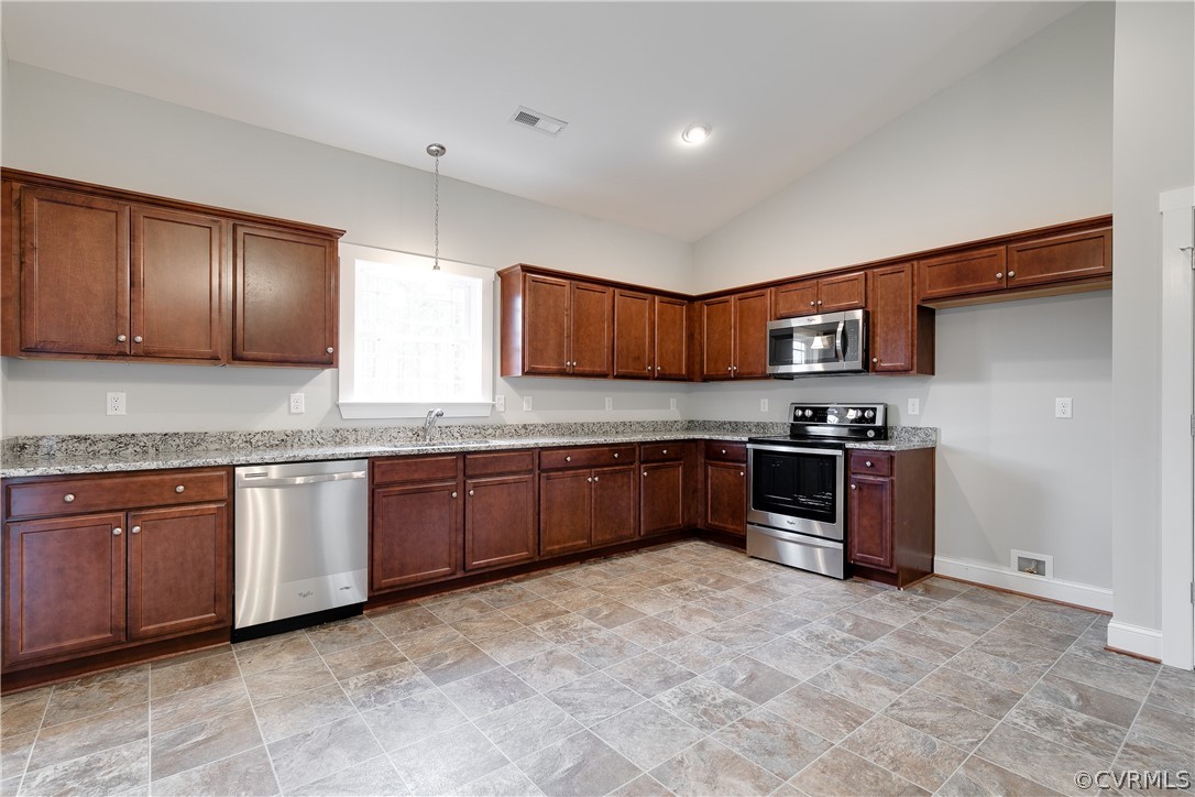 17715 Tyler Station Road Beaverdam, VA 23015 - Photo 7 of 18 a kitchen with stainless steel appliances granite countertop a refrigerator and a stove top oven