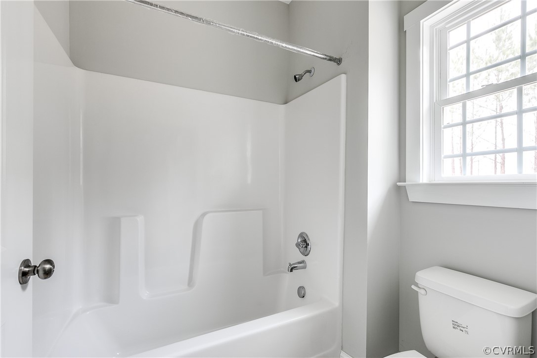 17715 Tyler Station Road Beaverdam, VA 23015 - Photo 10 of 18 a white bath tub sitting next to a white toilet
