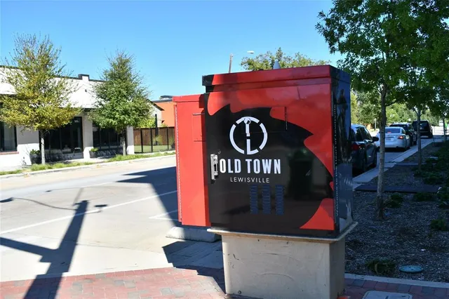 a sign board with a small yard