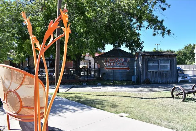 a view of swimming pool with a lounge chairs