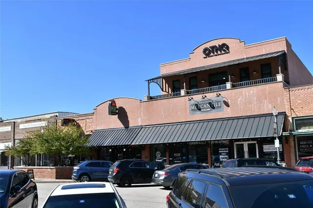 a front view of a building with parking space and a fireplace