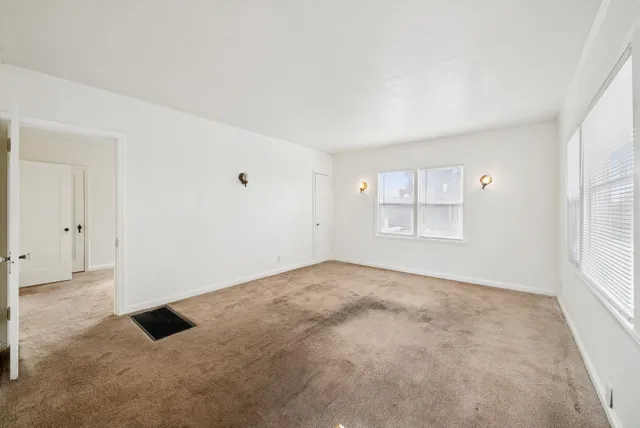 an empty room with windows