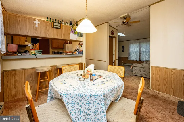 a dining room with a table and chairs