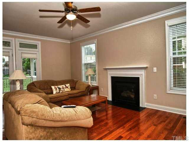 2736 Royal Forrest Drive Raleigh, NC 27614 - Photo 4 of 22 Light pours into this lovely home. The gas fireplace is a wonderful accent and the door leading to the screen porch expands this living space! Den/Family/Great Room