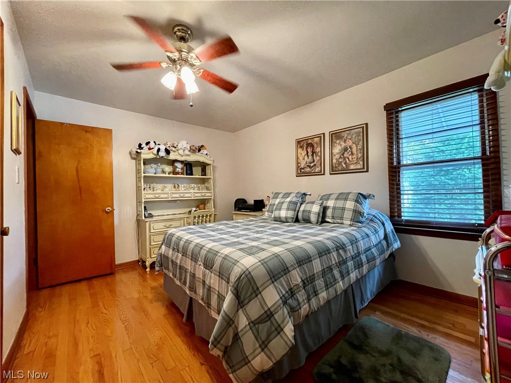 66119 Highway 124 Reedsville, OH 45772 - Photo 13 of 29 Hardwood floored bedroom featuring ceiling fan