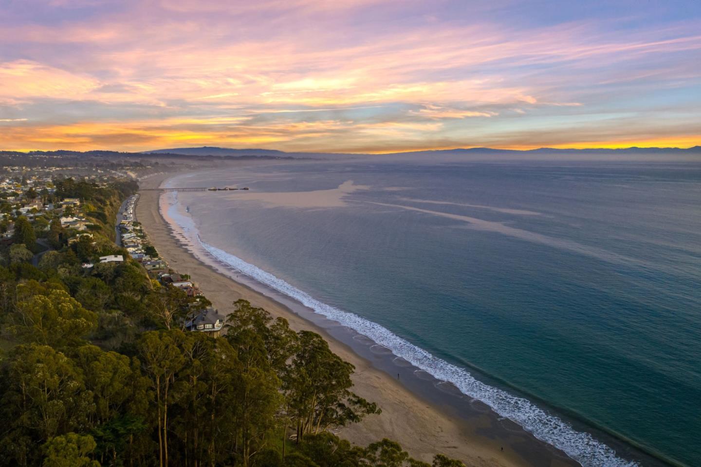 a view of an ocean and a mountain