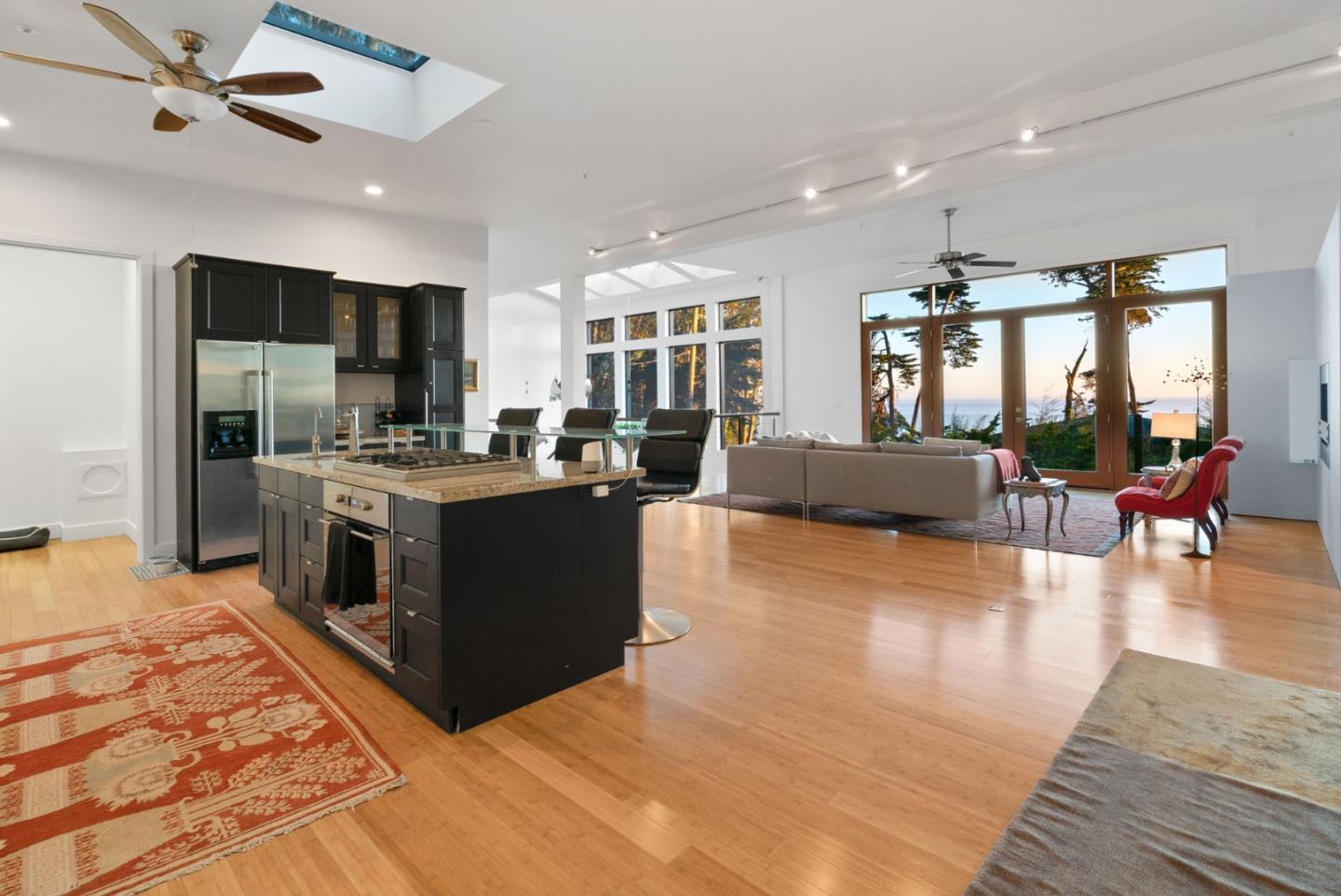 116 New Brighton Road Aptos, CA 95003 - Photo 18 of 50 a kitchen with stainless steel appliances kitchen island granite countertop a stove and a refrigerator