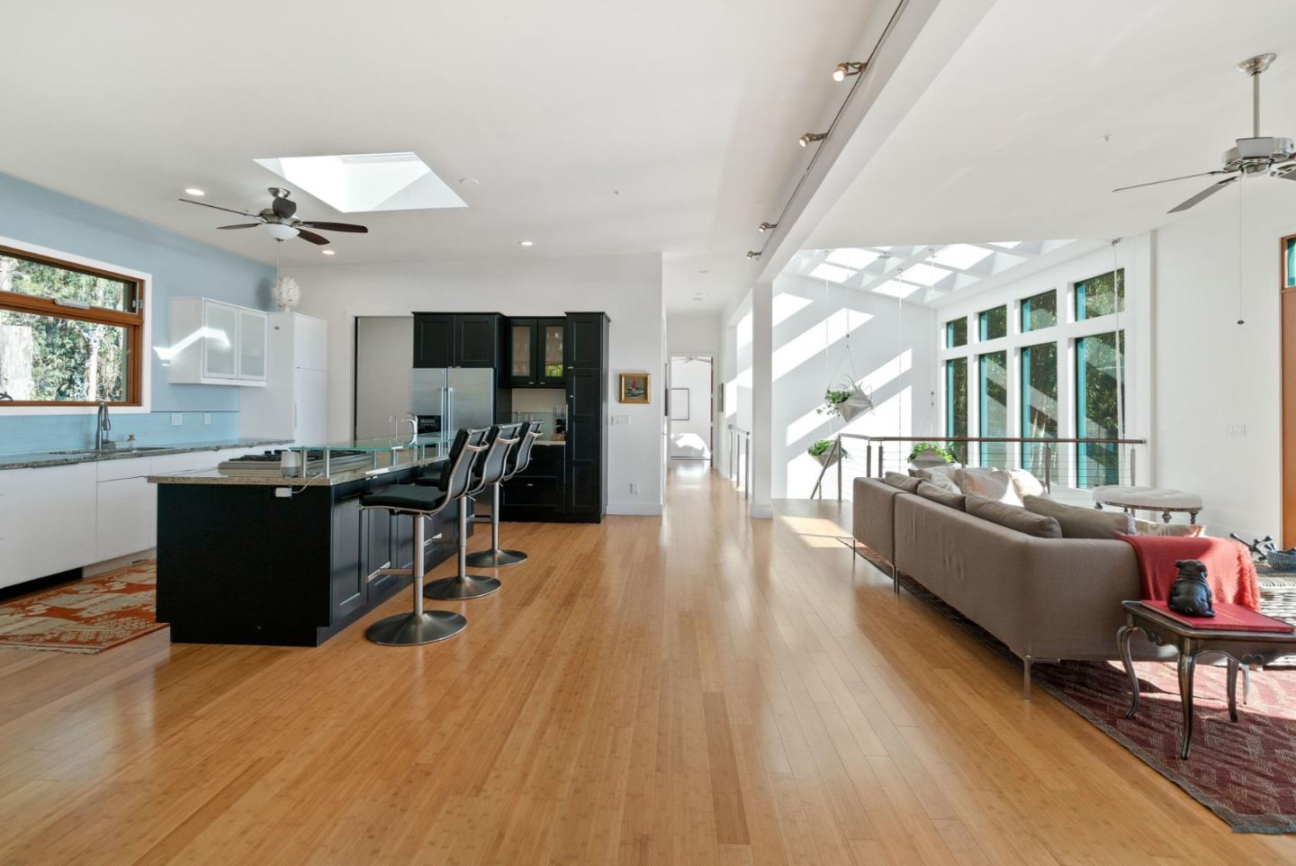 116 New Brighton Road Aptos, CA 95003 - Photo 24 of 50 a living room with furniture and a wooden floor