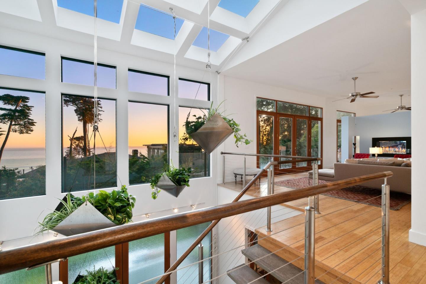 116 New Brighton Road Aptos, CA 95003 - Photo 4 of 50 a view of a living room and kitchen floor to ceiling windows