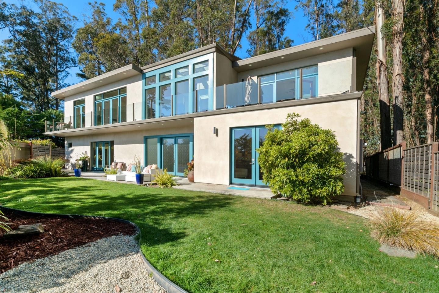116 New Brighton Road Aptos, CA 95003 - Photo 6 of 50 a front view of a house with a yard table and chairs