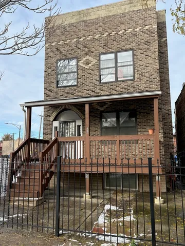 a front view of a house with glass windows