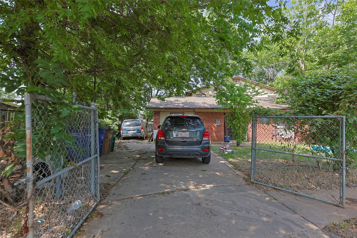 6110 Calmar Cove Austin, TX 78721 - Photo 13 of 26 a view of a car in front of a house with a small yard