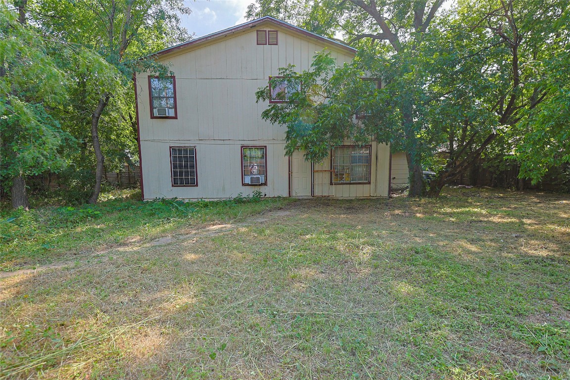 6110 Calmar Cove Austin, TX 78721 - Photo 10 of 26 a white house that has a tree in front of it