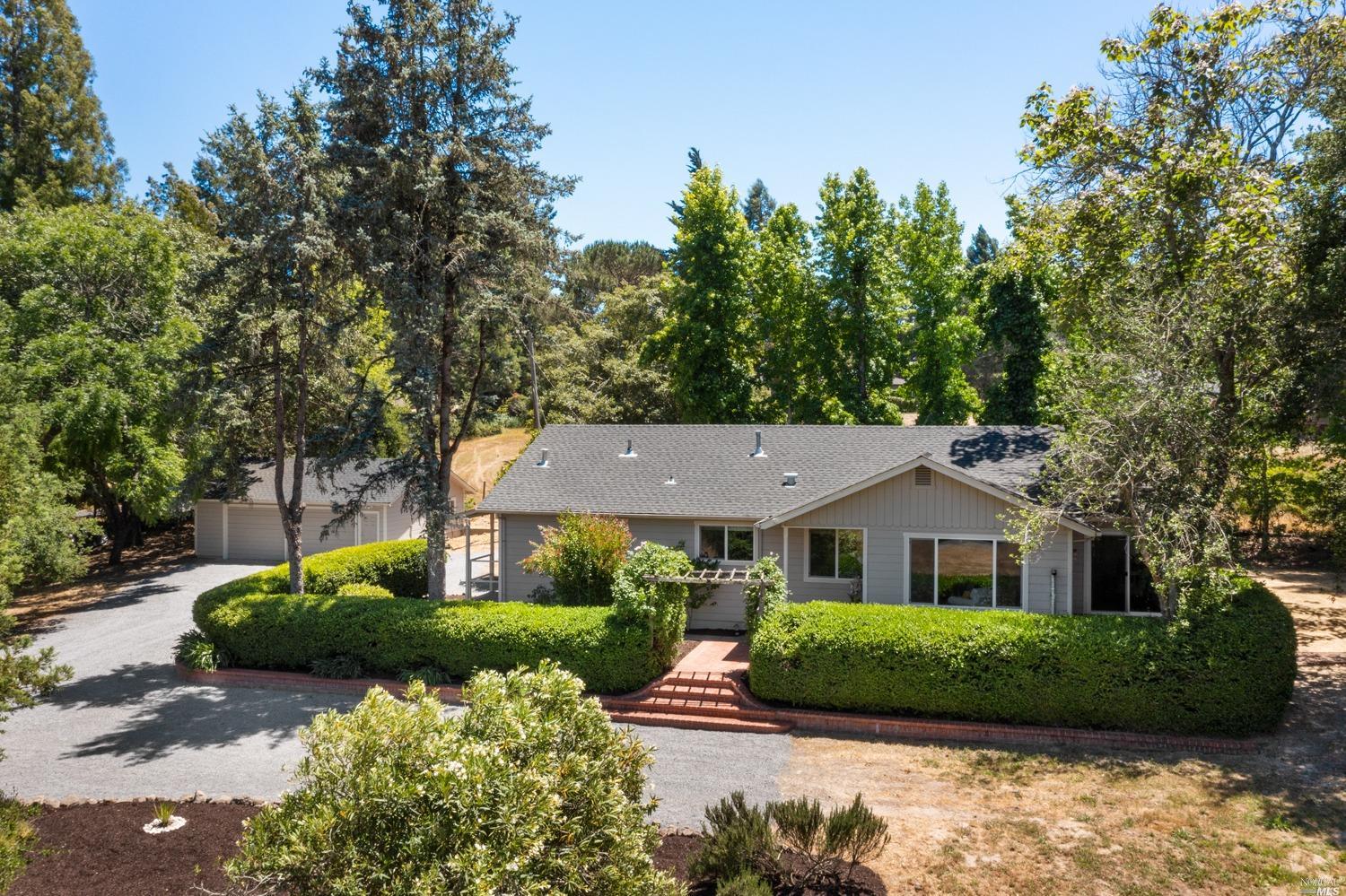 1036 Pleasant Hill Road Sebastopol, CA 95472 - Photo 1 of 1 a front view of a house with a yard