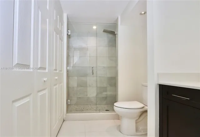 a bathroom with a shower and a toilet