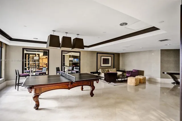 a living room with furniture gym equipment and view of living room