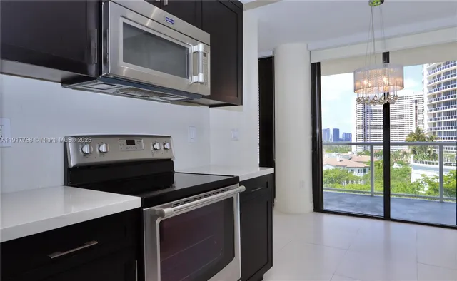 a kitchen with a stove and a microwave