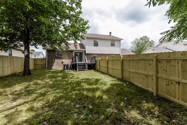 a picture of a park with an bench