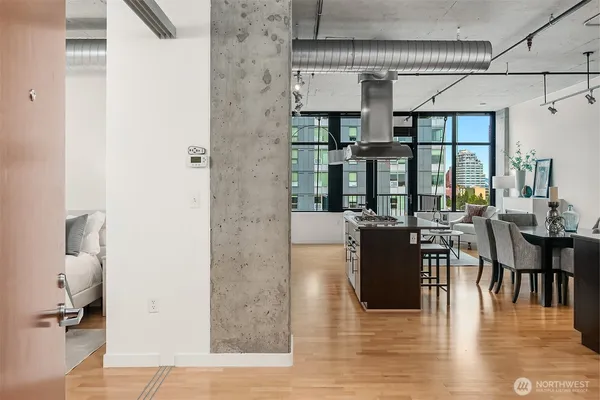 an open kitchen with dining table and chairs