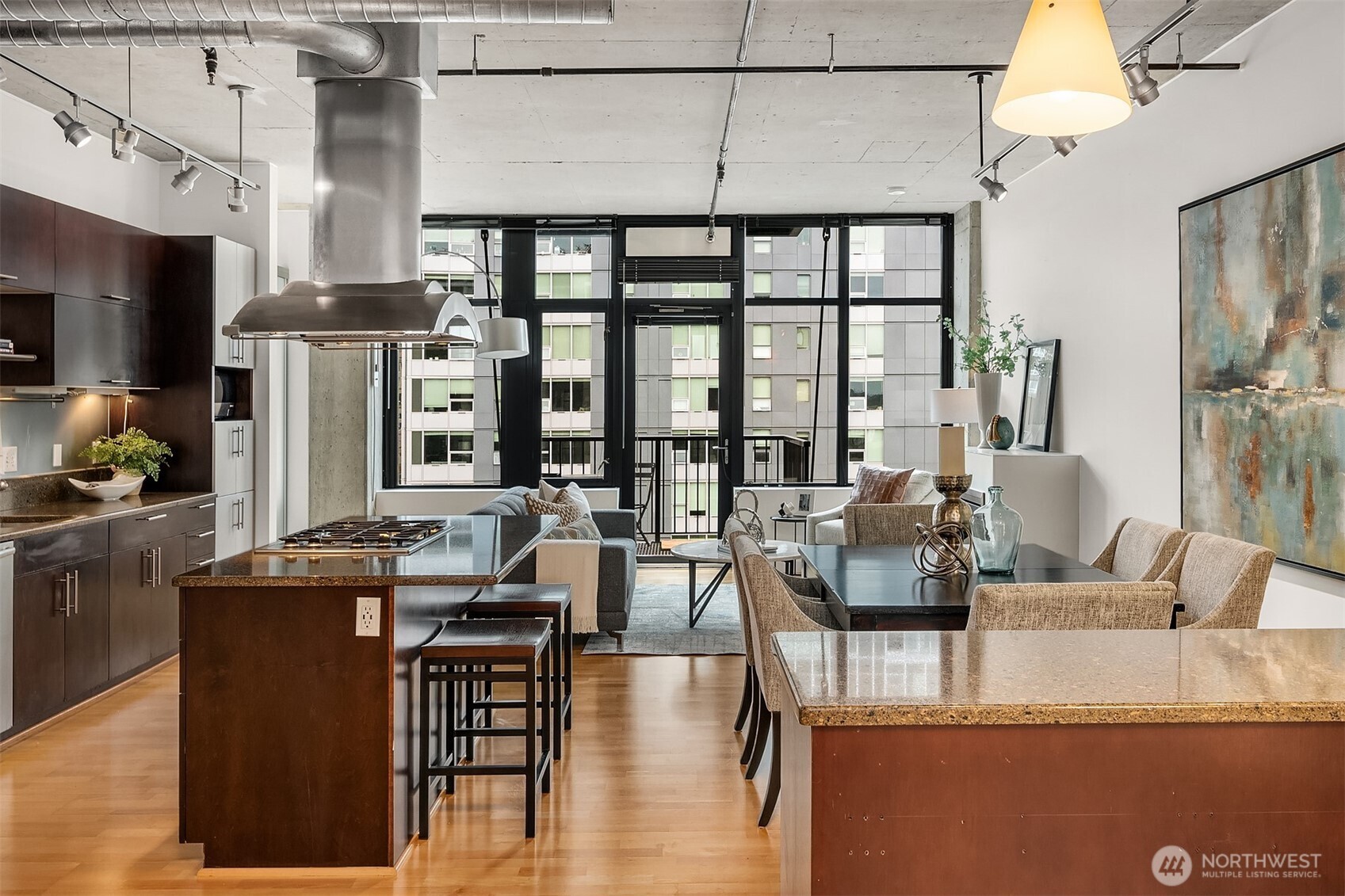 2720 3rd Avenue, Unit 909 Seattle, WA 98121 - Photo 17 of 40 a living room with fireplace furniture and a large window