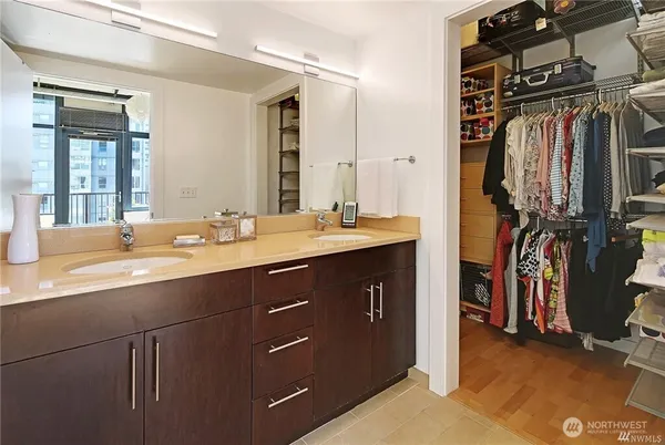 a bathroom with a sink double vanity and a mirror