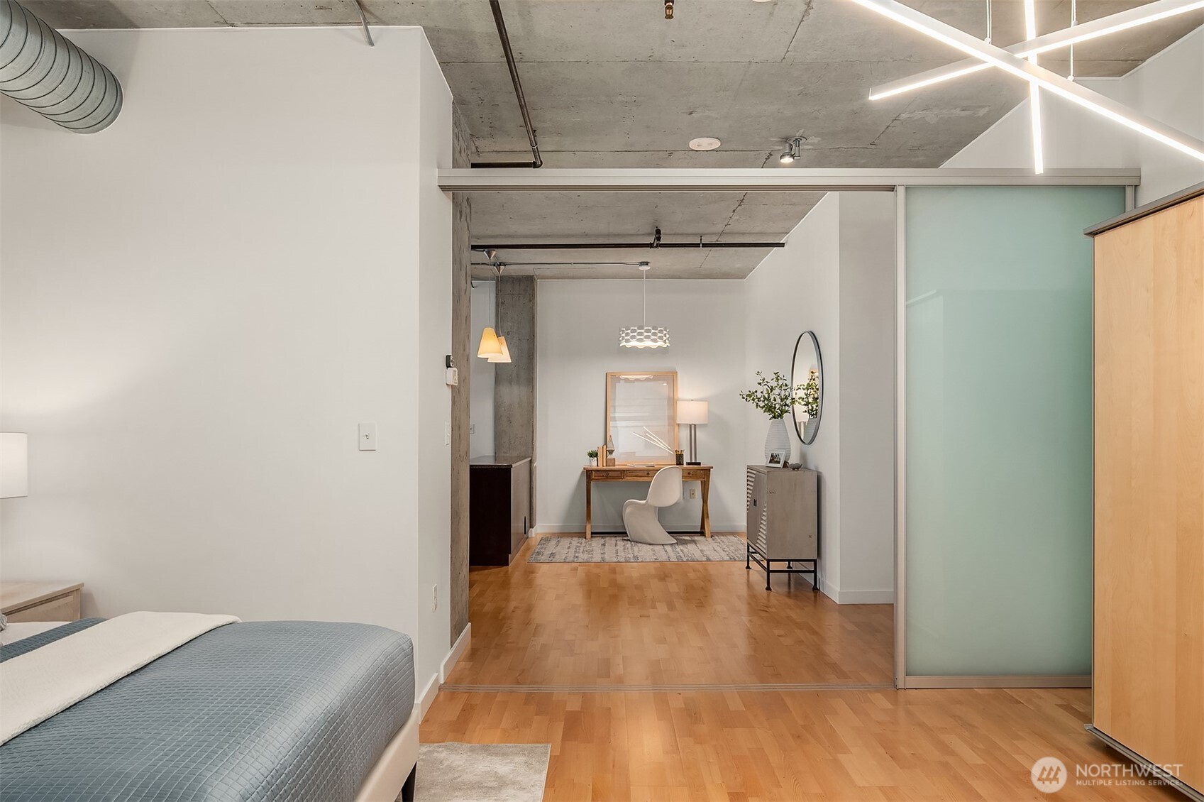 2720 3rd Avenue, Unit 909 Seattle, WA 98121 - Photo 31 of 40 a view of a livingroom with furniture and hardwood floor