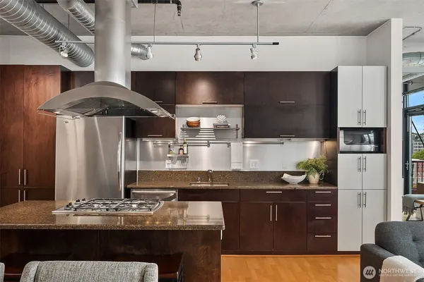 a kitchen with a sink and cabinets