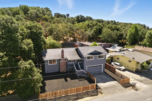 aerial view of a house with a yard