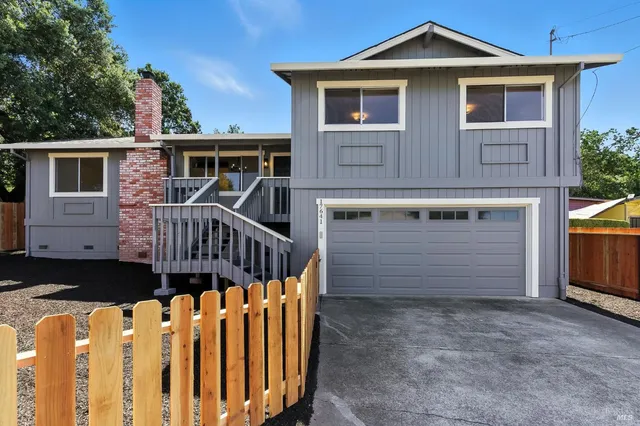 an aerial view of a house with a garden