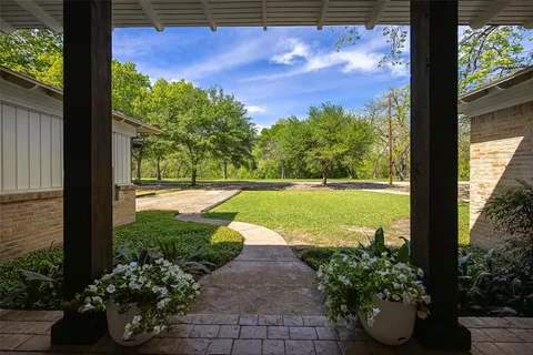 a view of a patio with furniture